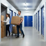 Man and woman unloading boxes into a secure self storage unit in Alloa