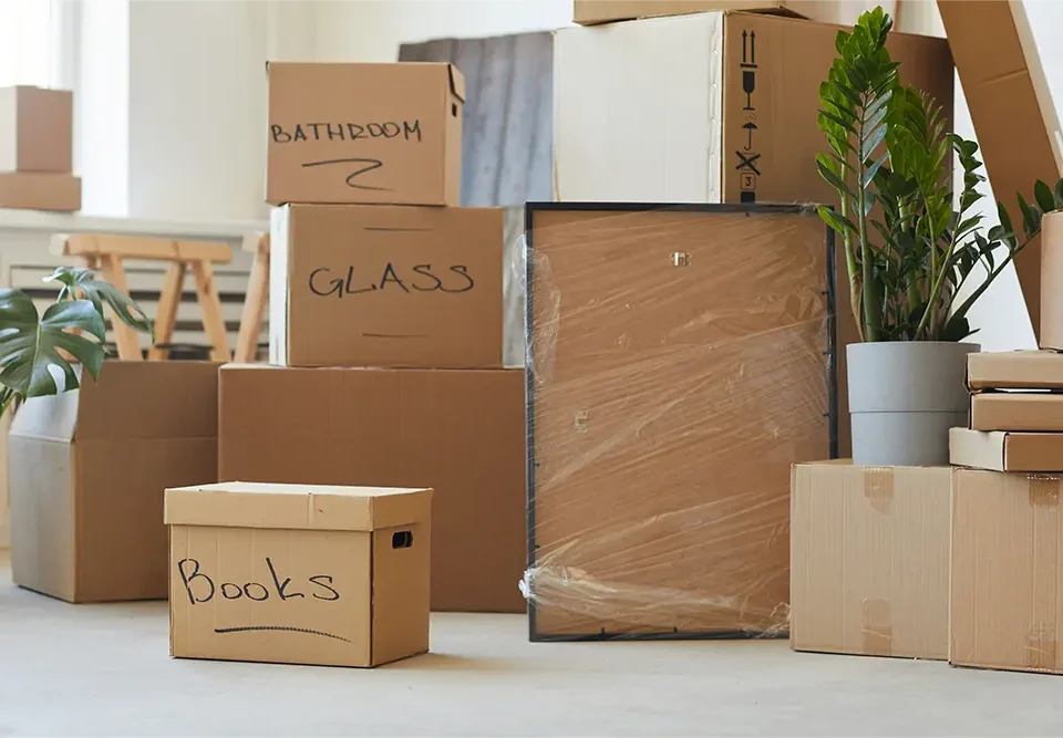 Moving boxes in Clackmannanshire stacked and labelled inside a home during a house move